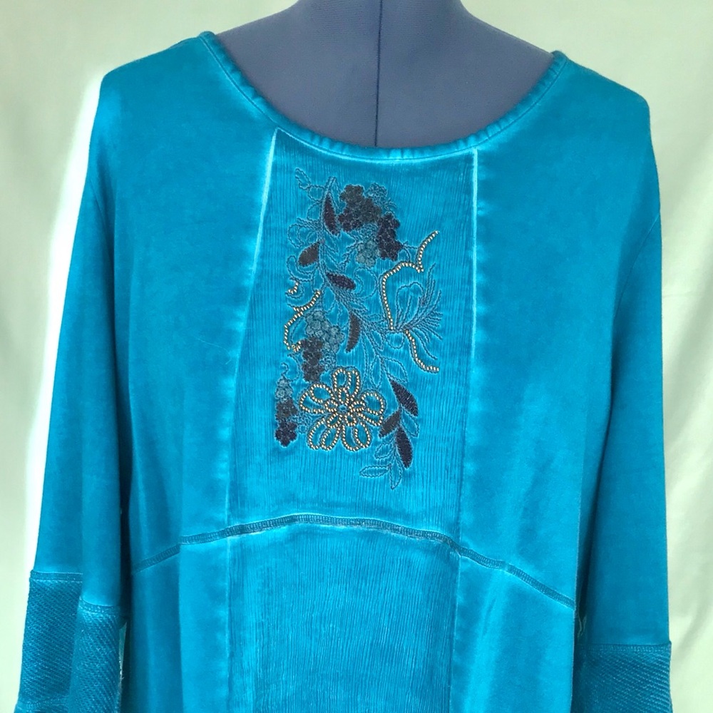 Top has a Beads and Embroidery on a silk panel.